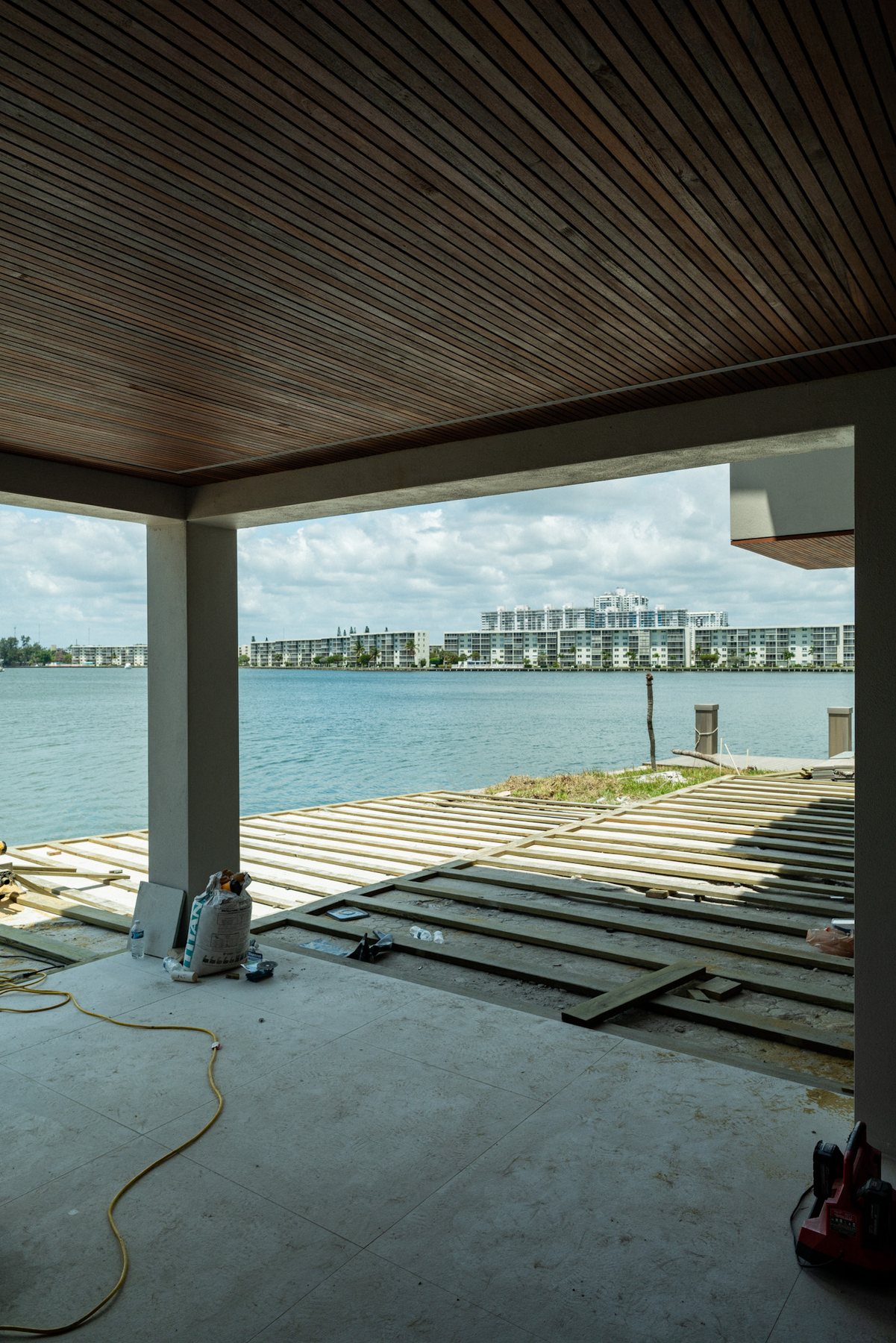 Covered waterfront terrace with a wide bay view