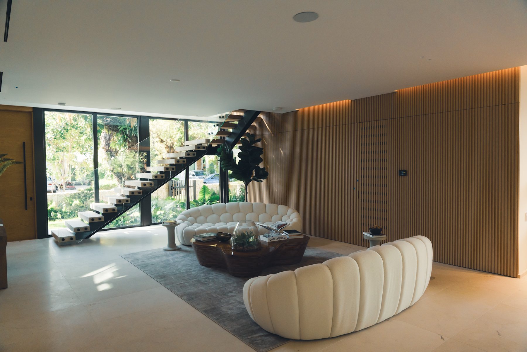 Considered interior with sculptural seating and natural light