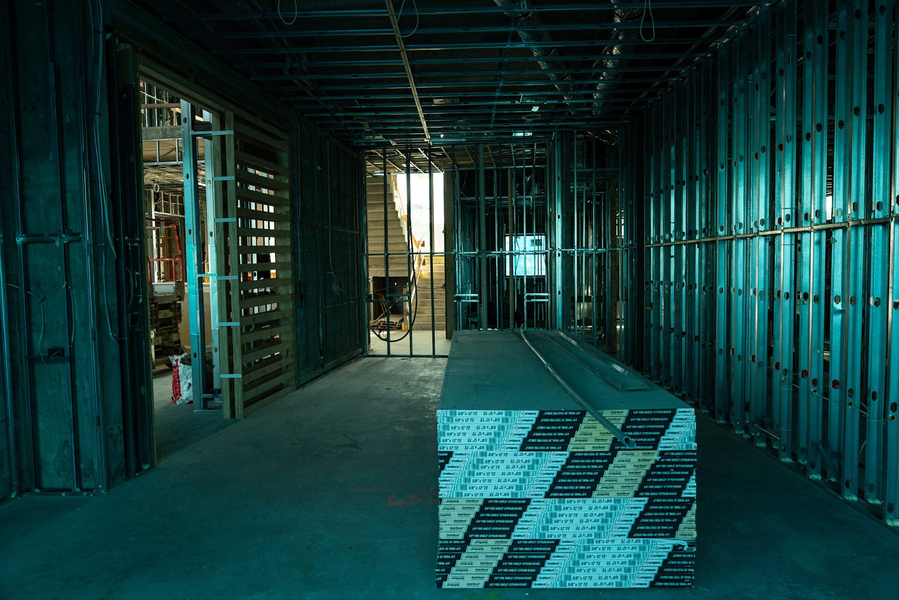 Long framed interior showing circulation and structural depth