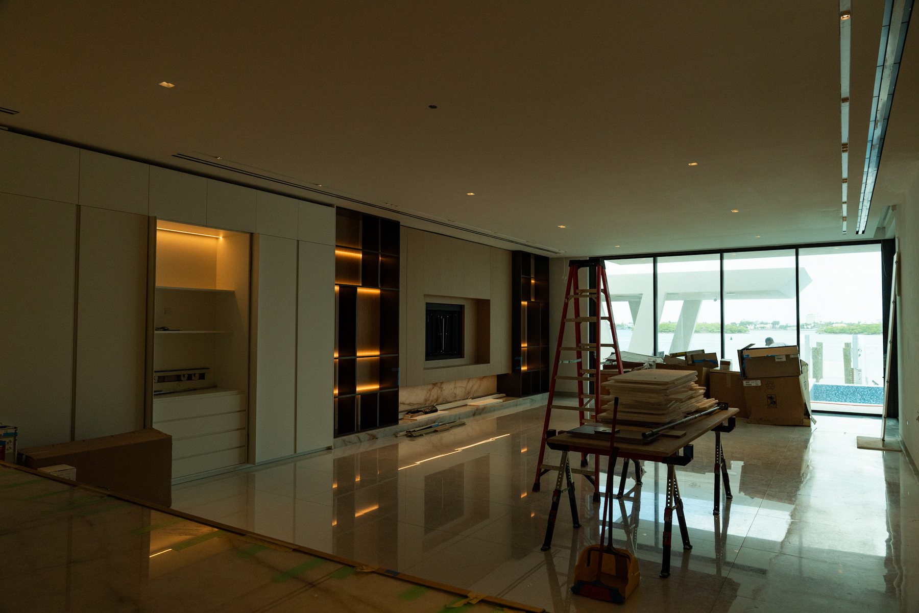 Open dining and living space with water beyond